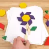 Joc educativ, Tangram cu 125 piese geometrice din lemn si fise de lucru, multicolor, 3 ani+